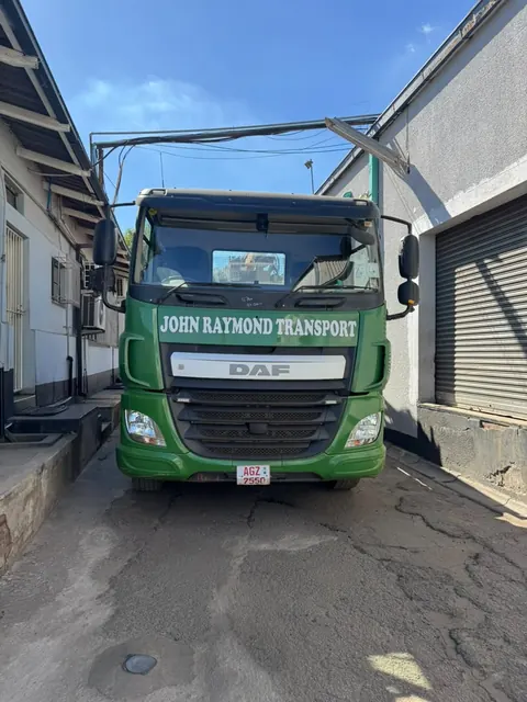 Delivery truck on the road carrying building materials to a customer in Harare