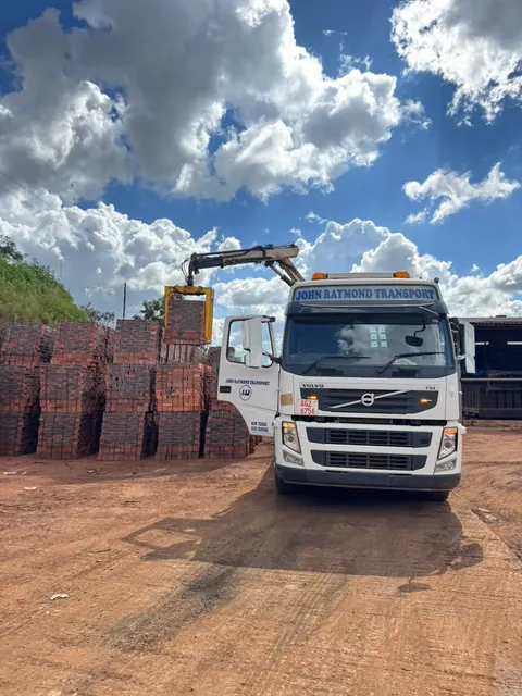 Building sand and stones delivered together to a construction site