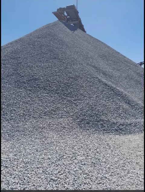 Pile of 3/4 stones ready to be loaded into a tipper for delivery in Harare